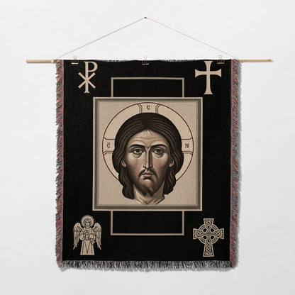 Religious tapestry featuring a portrait of Jesus Christ, with symbols of faith.