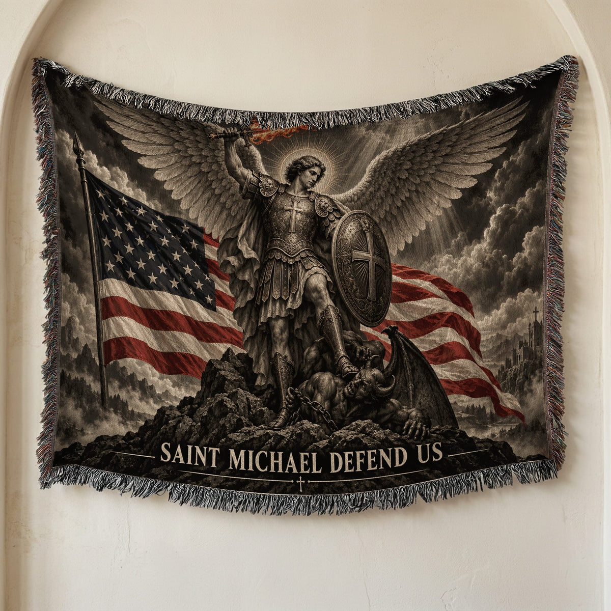 Woven throw blanket featuring Saint Michael subduing a demon, with an American flag and text Saint Michael Defend Us.