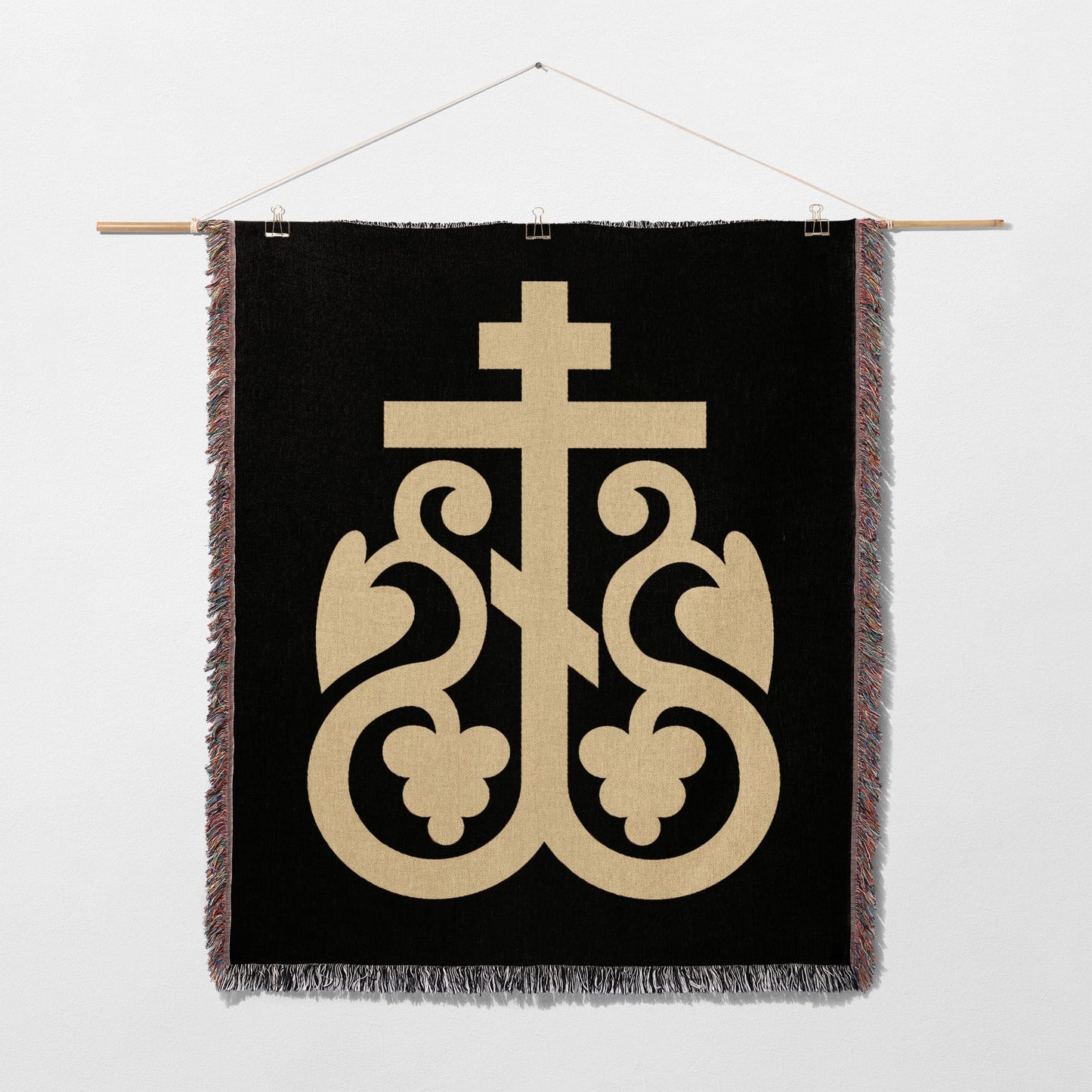 Black woven tapestry with ornate gold cross emblem and decorative flourishes.