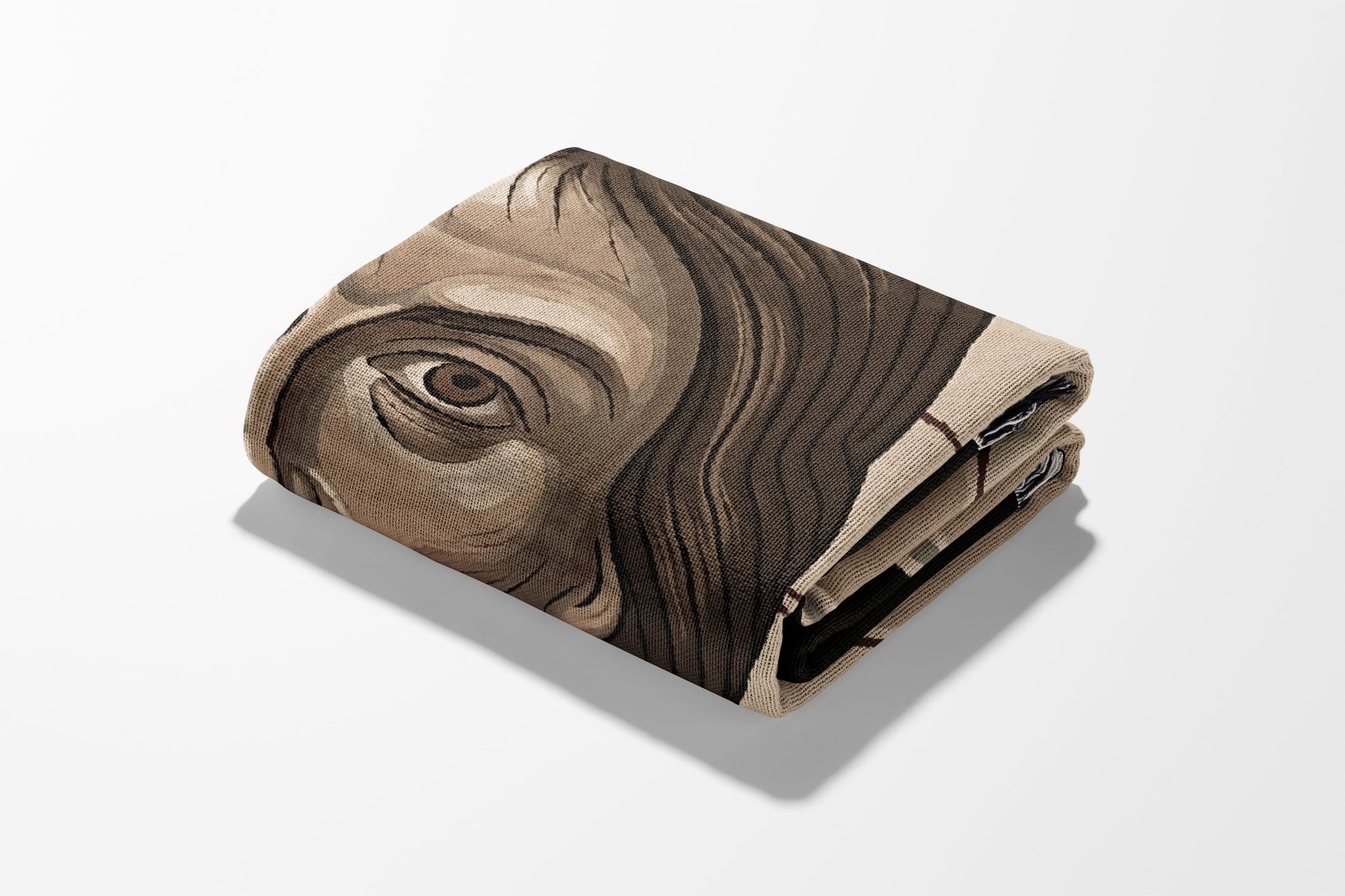 Folded blanket featuring a close-up illustration of a human eye and face.