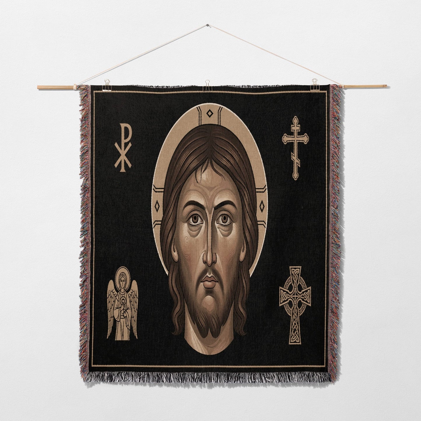 Icon tapestry featuring Jesus' face surrounded by religious symbols.