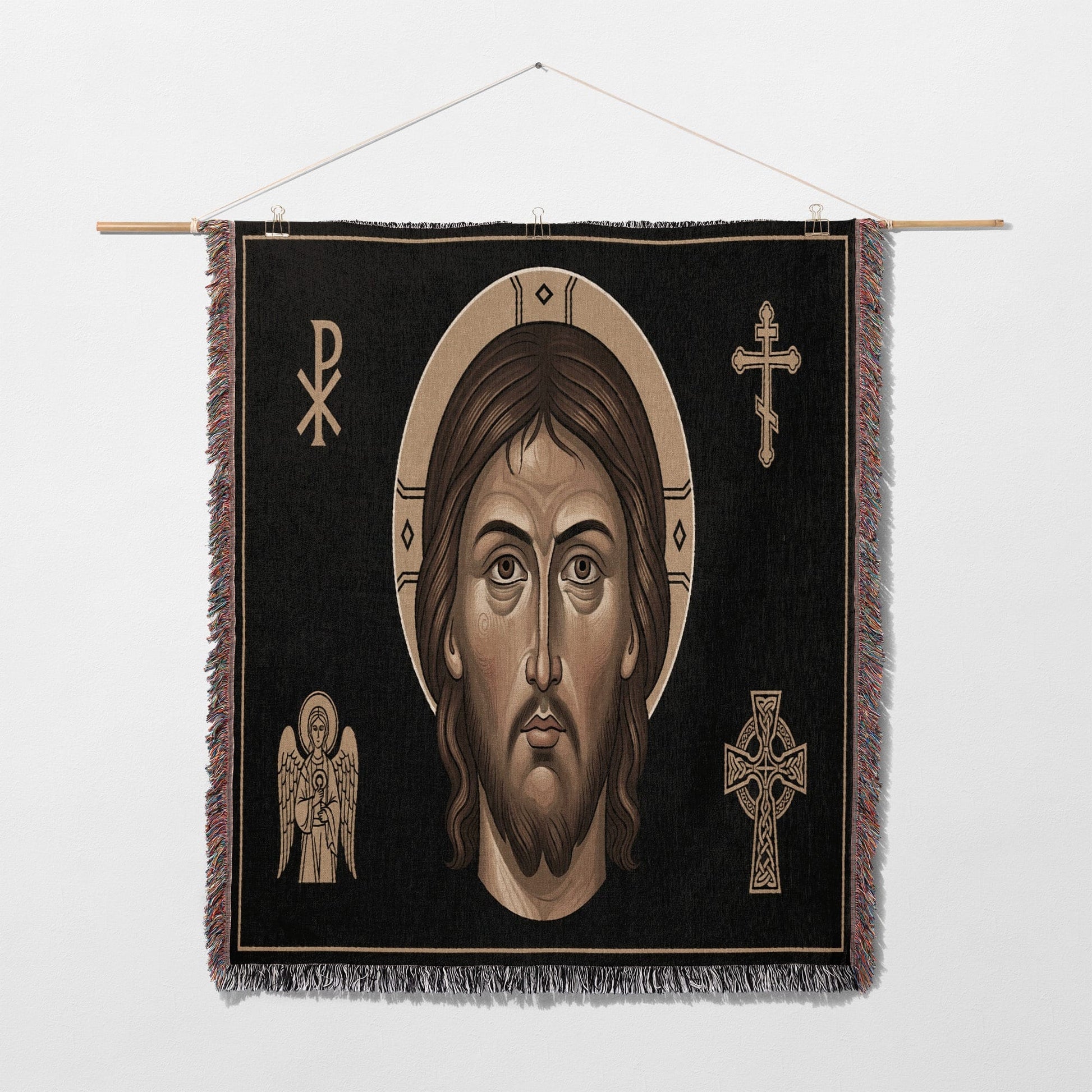Icon tapestry featuring Jesus' face surrounded by religious symbols.