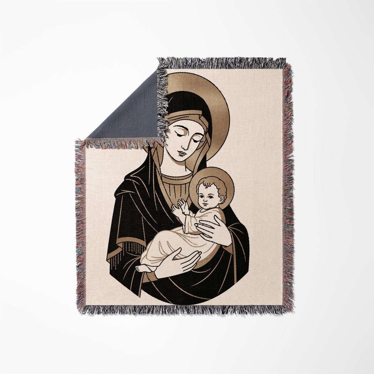 Madonna and Child illustration on a fringed throw blanket.