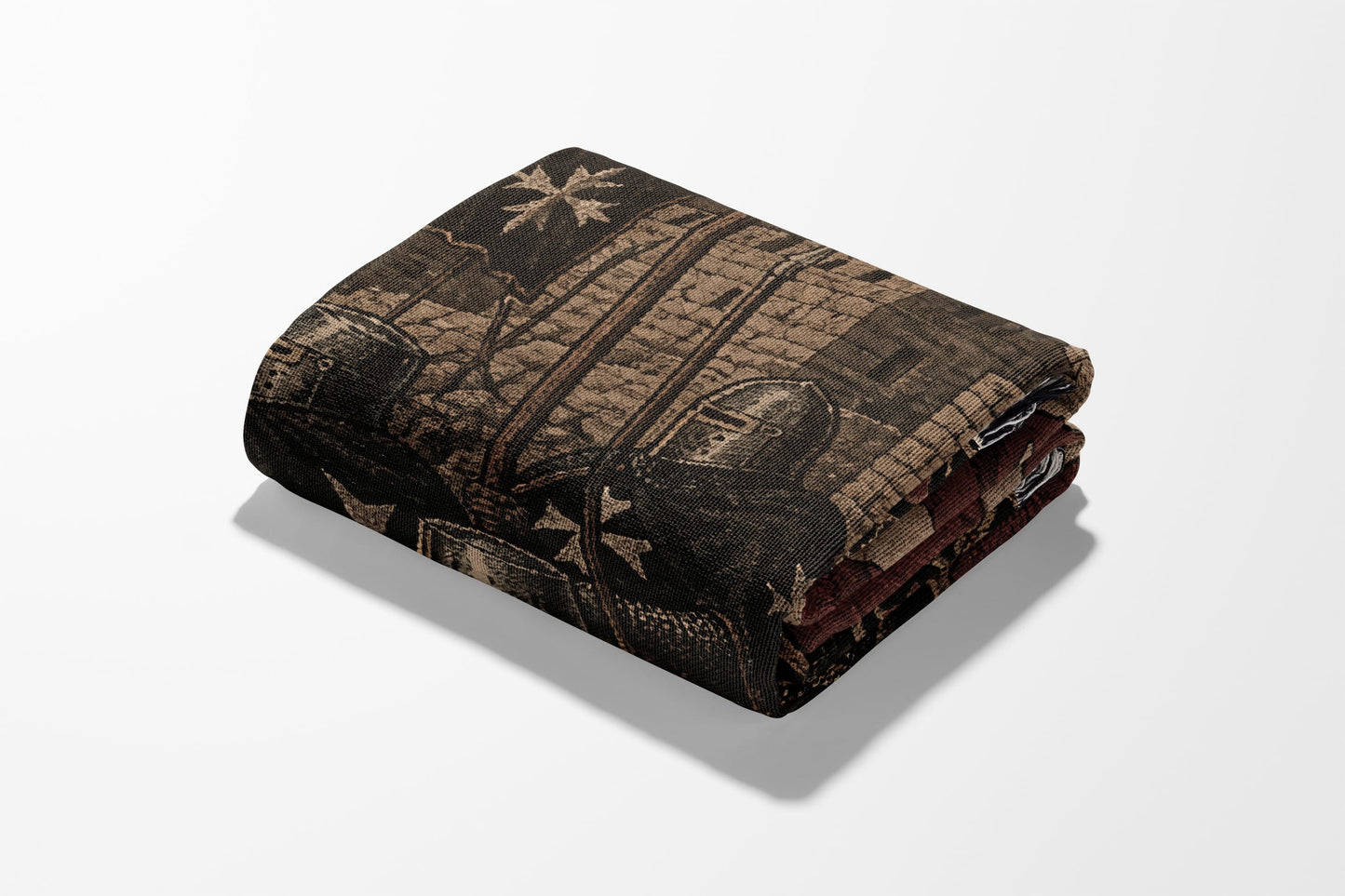 Folded blanket with medieval knight helmet and cross pattern.