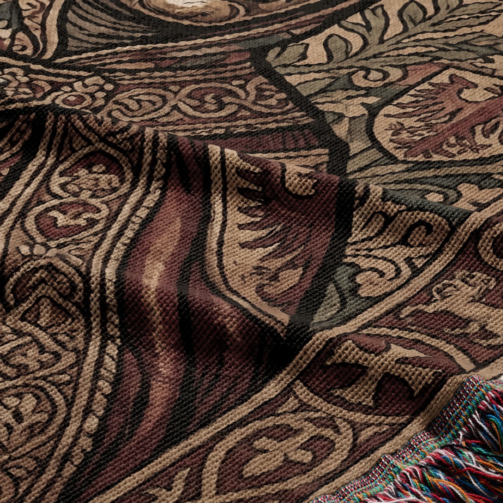 Textile with woven medieval-style pattern in brown, beige, and dark green with colorful fringe.