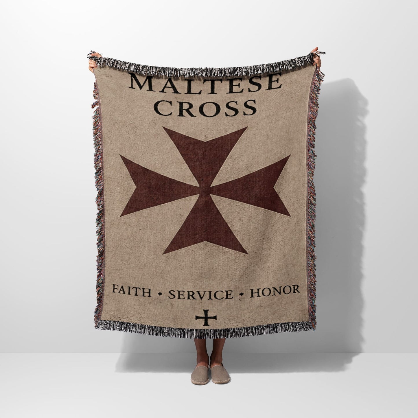 Fringed tapestry blanket with Maltese Cross and text "Maltese Cross Faith. Service. Honor."