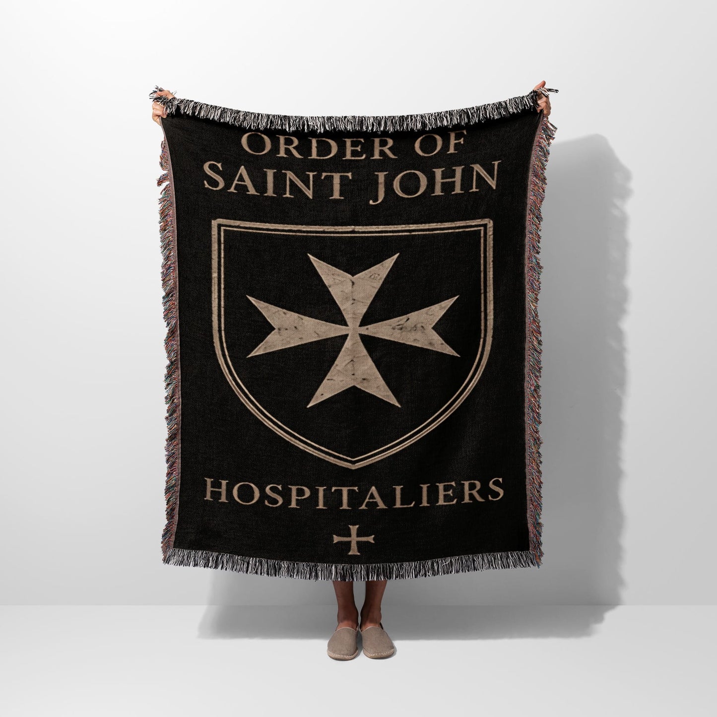 Black blanket with fringe, featuring "ORDER OF SAINT JOHN HOSPITALIER" and a Maltese cross.