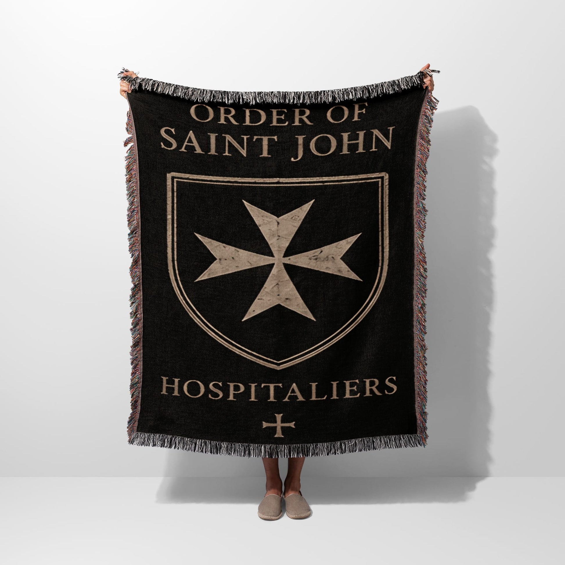 Black blanket with fringe, featuring "ORDER OF SAINT JOHN HOSPITALIER" and a Maltese cross.