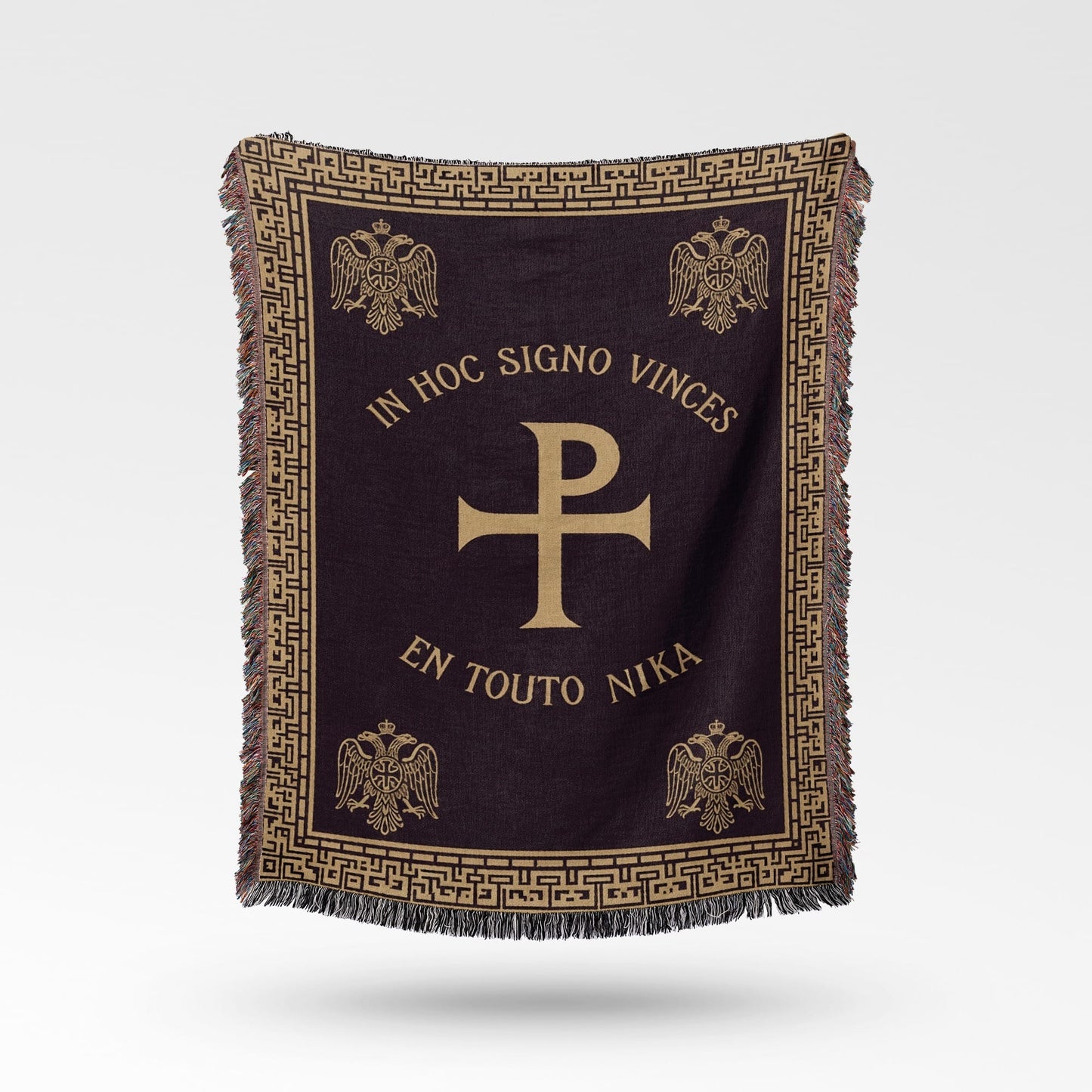 Dark throw blanket with gold Greek inscription, Chi-Rho symbol, and eagles.