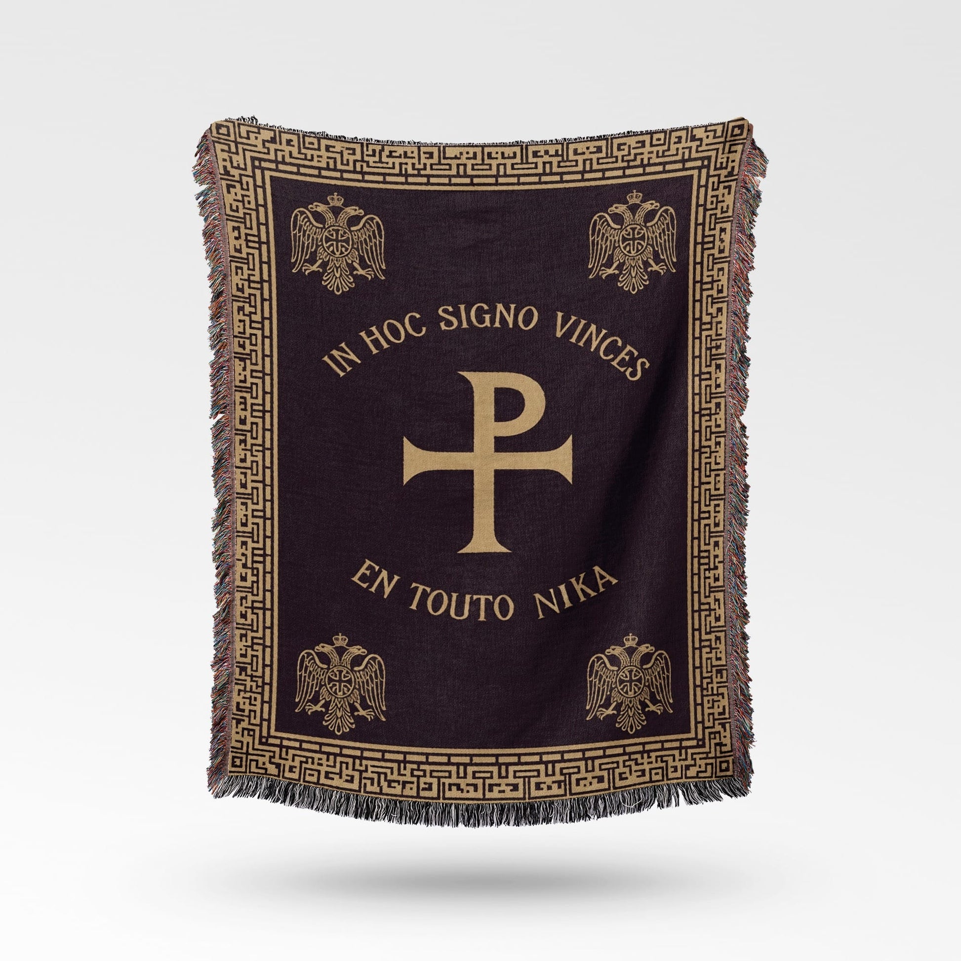 Dark throw blanket with gold Greek inscription, Chi-Rho symbol, and eagles.