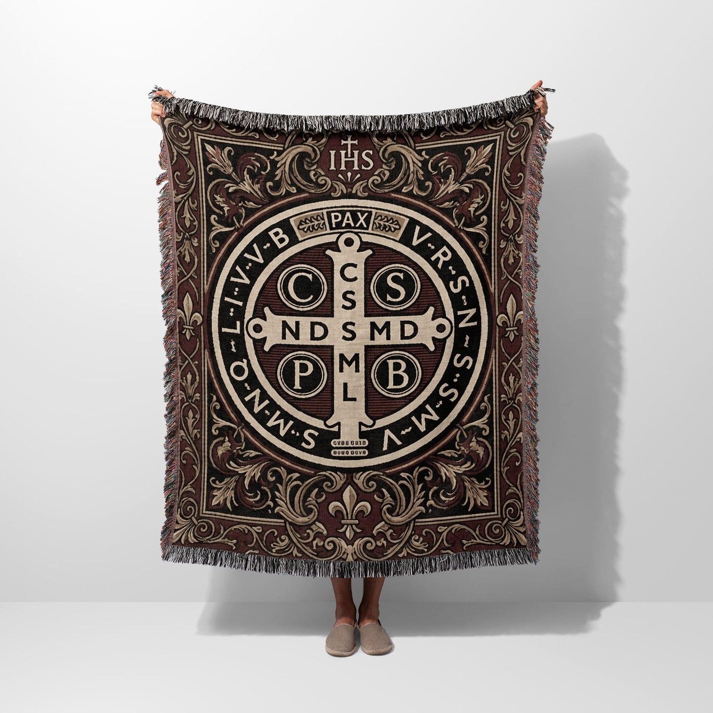 Tapestry with St. Benedict's medal, IHS, and PAX text in intricate brown design.