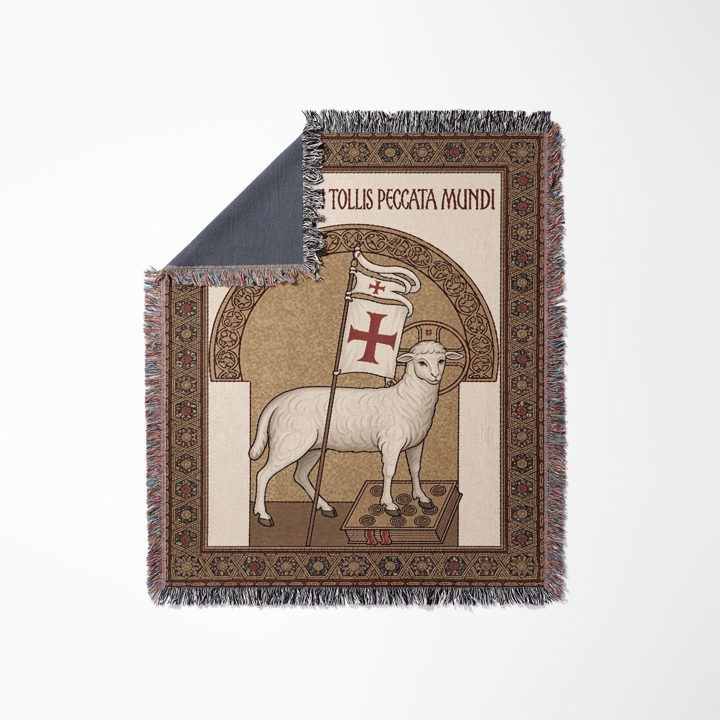 Lamb of God with flag, text "Tollis Peccata Mundi" on woven blanket.