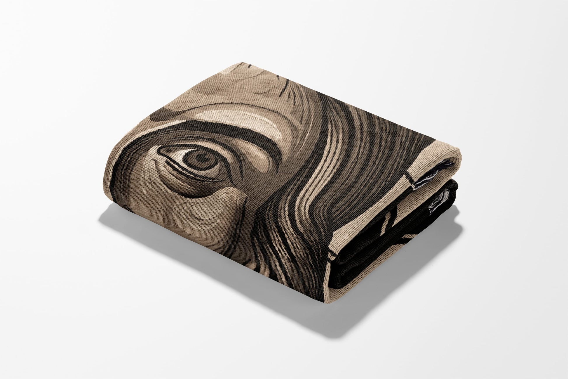 Folded blanket with a detailed portrait of a person's eye.