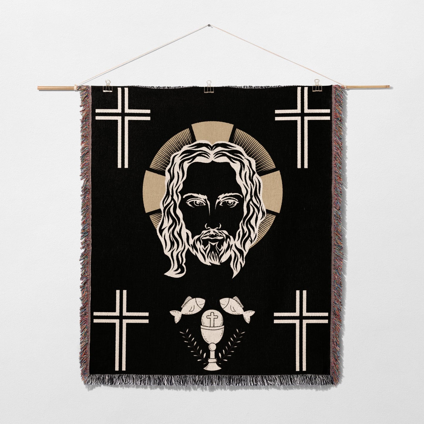 Jesus Christ face with crosses, chalice, and fish on a black tapestry.