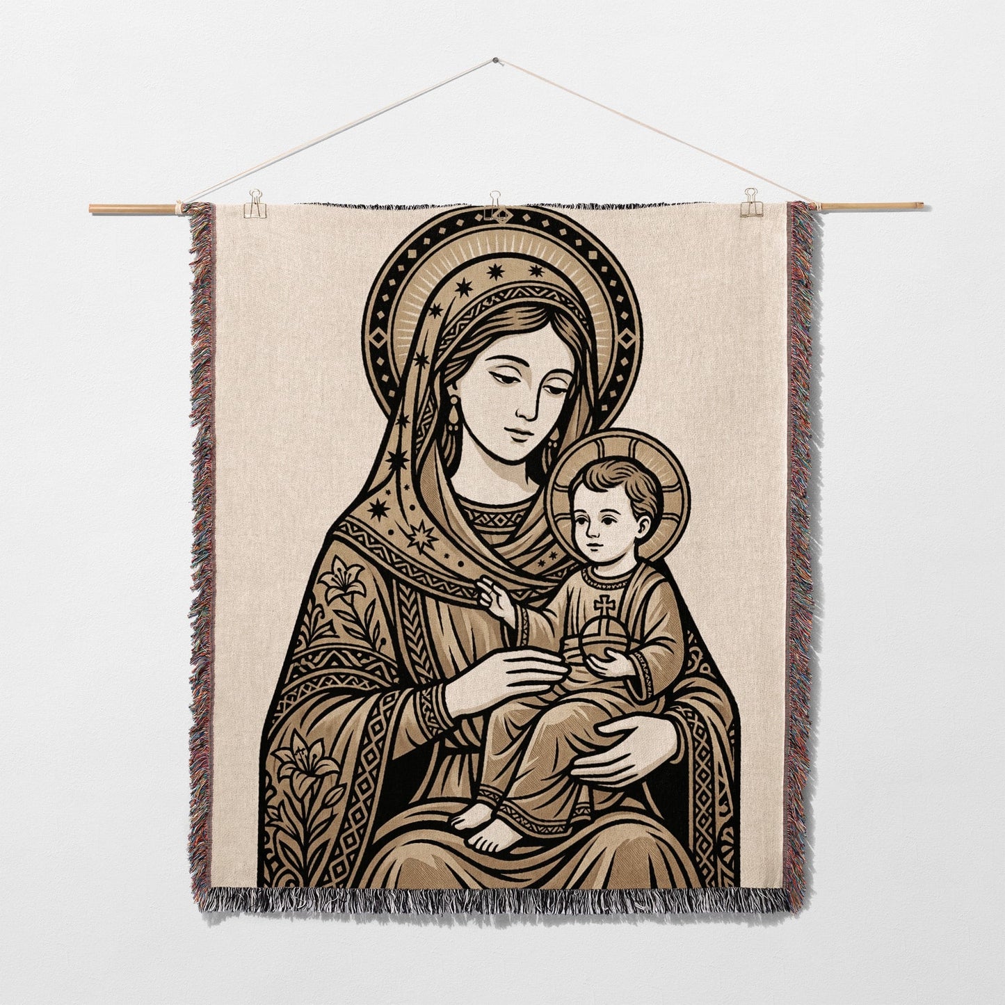 Tapestry of the Virgin Mary holding the infant Jesus, with ornate border.