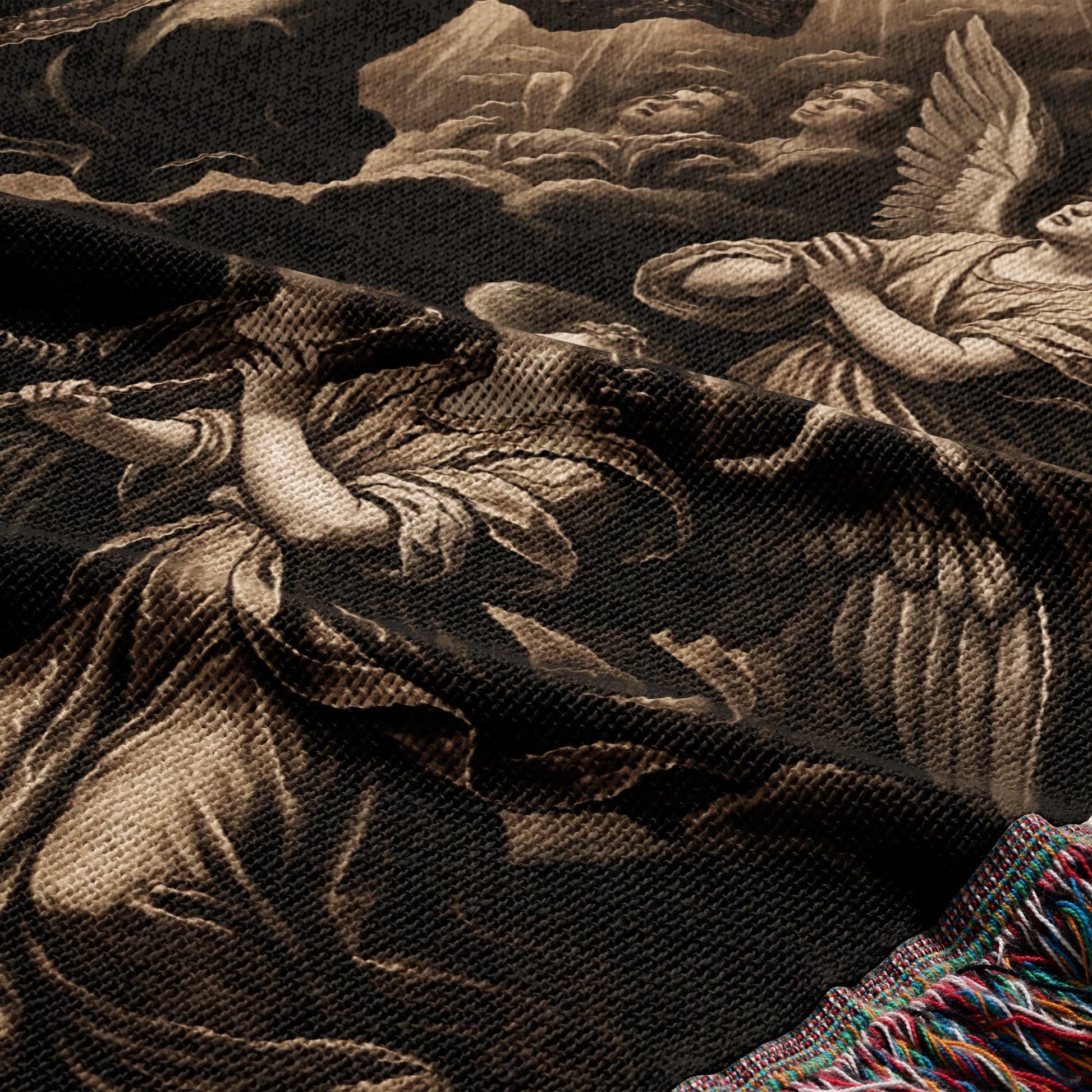 Tapestry with angels in a celestial scene, fringed edge visible.