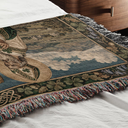 Woven throw blanket featuring a Saint Patrick design, spread across a white bed.