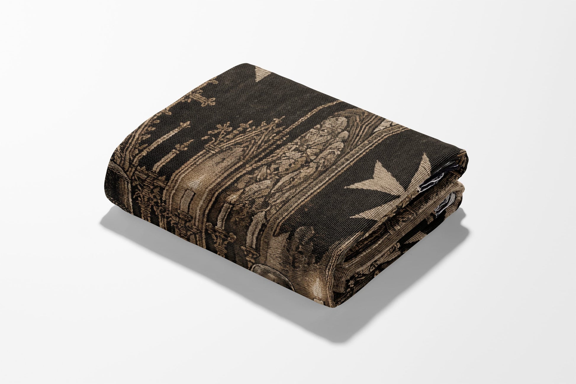 Folded blanket with intricate gothic architecture and Maltese cross pattern.