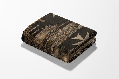 Folded blanket with intricate gothic architecture and Maltese cross pattern.