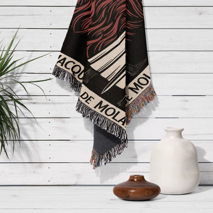Black and red fringe scarf with "ACQUA DE MOLA" text, on white wall.