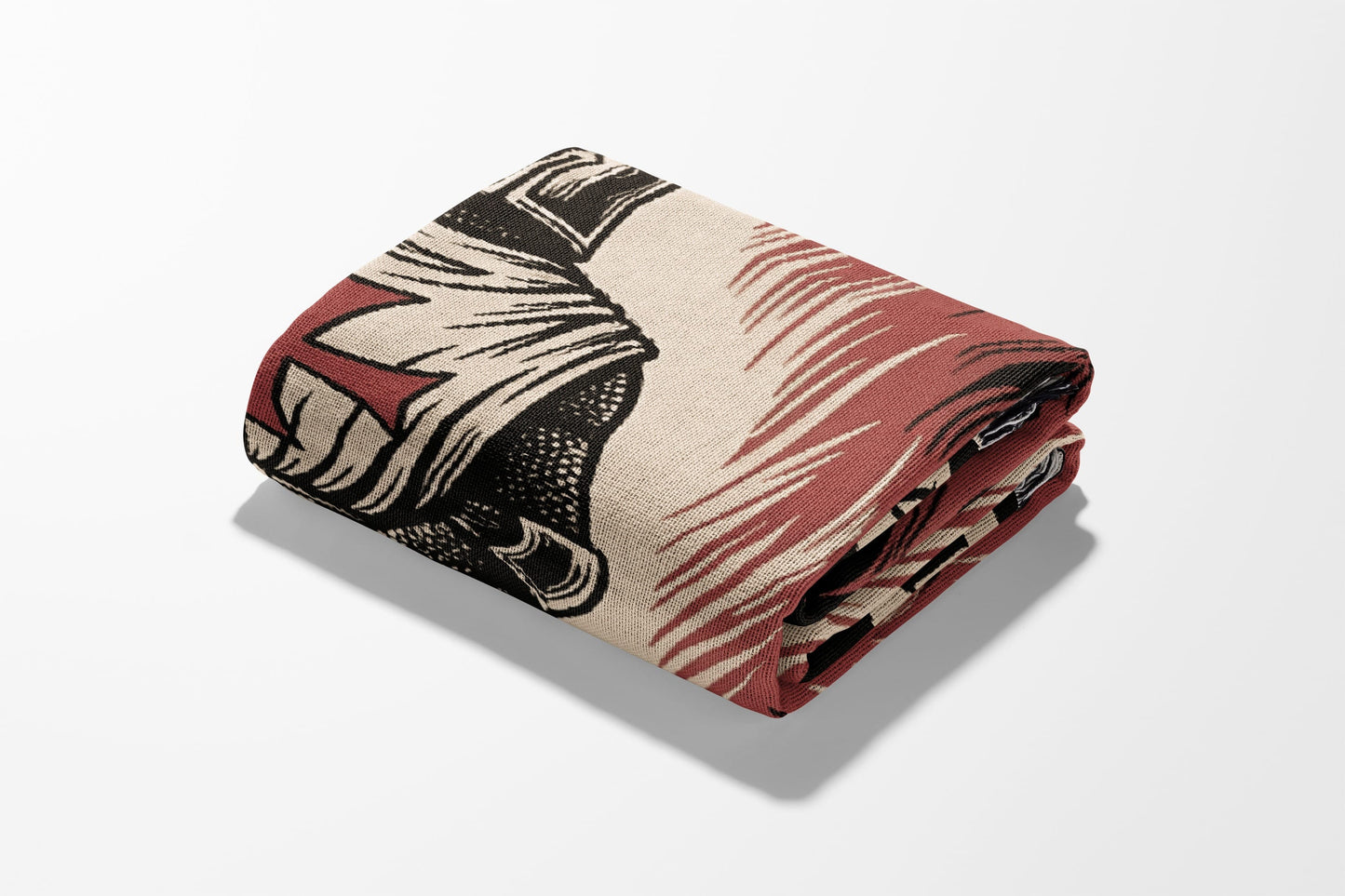 Folded blanket with a dark, detailed medieval knight design.