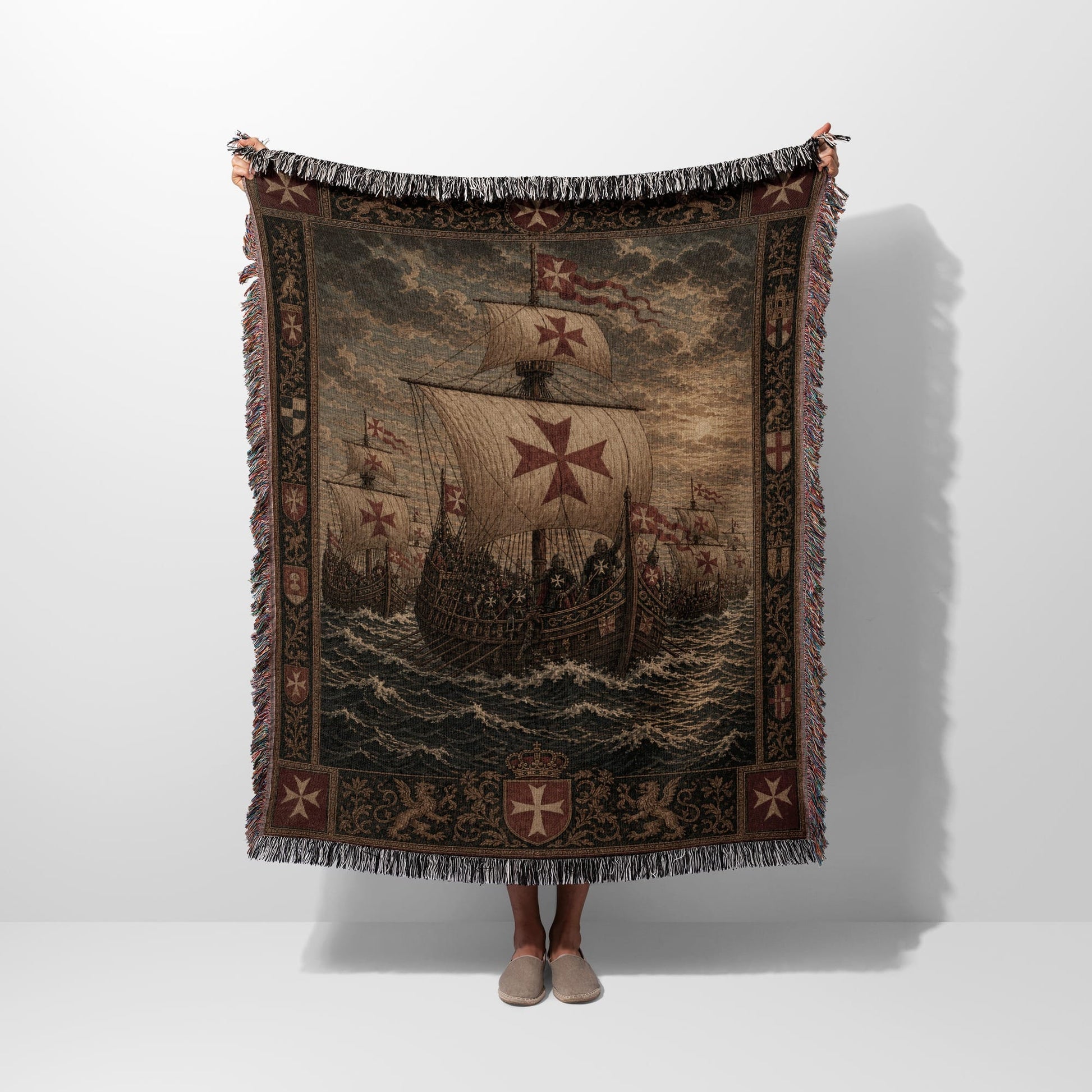 Tapestry blanket with ships and Maltese crosses.