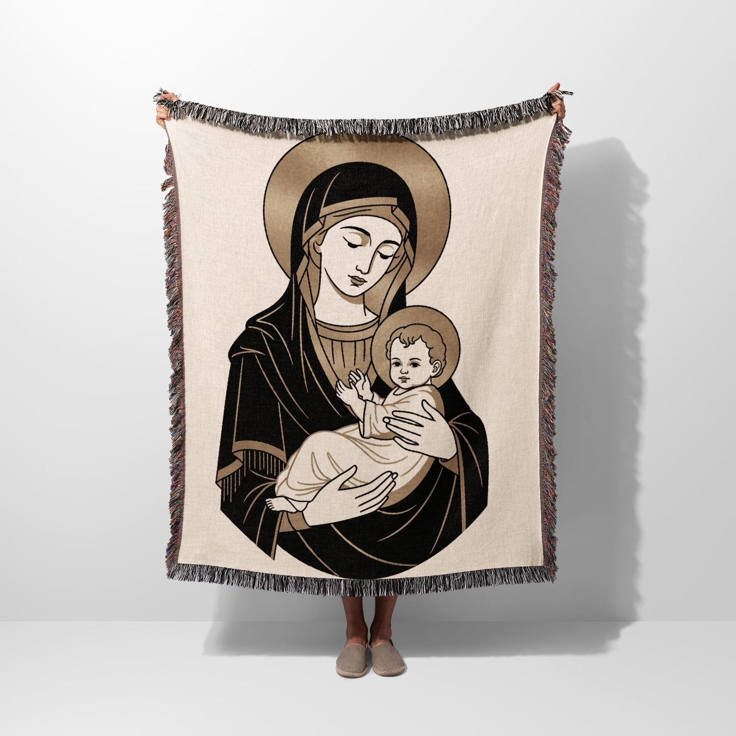 Illustration of Madonna and Child on a woven blanket held up by a person.