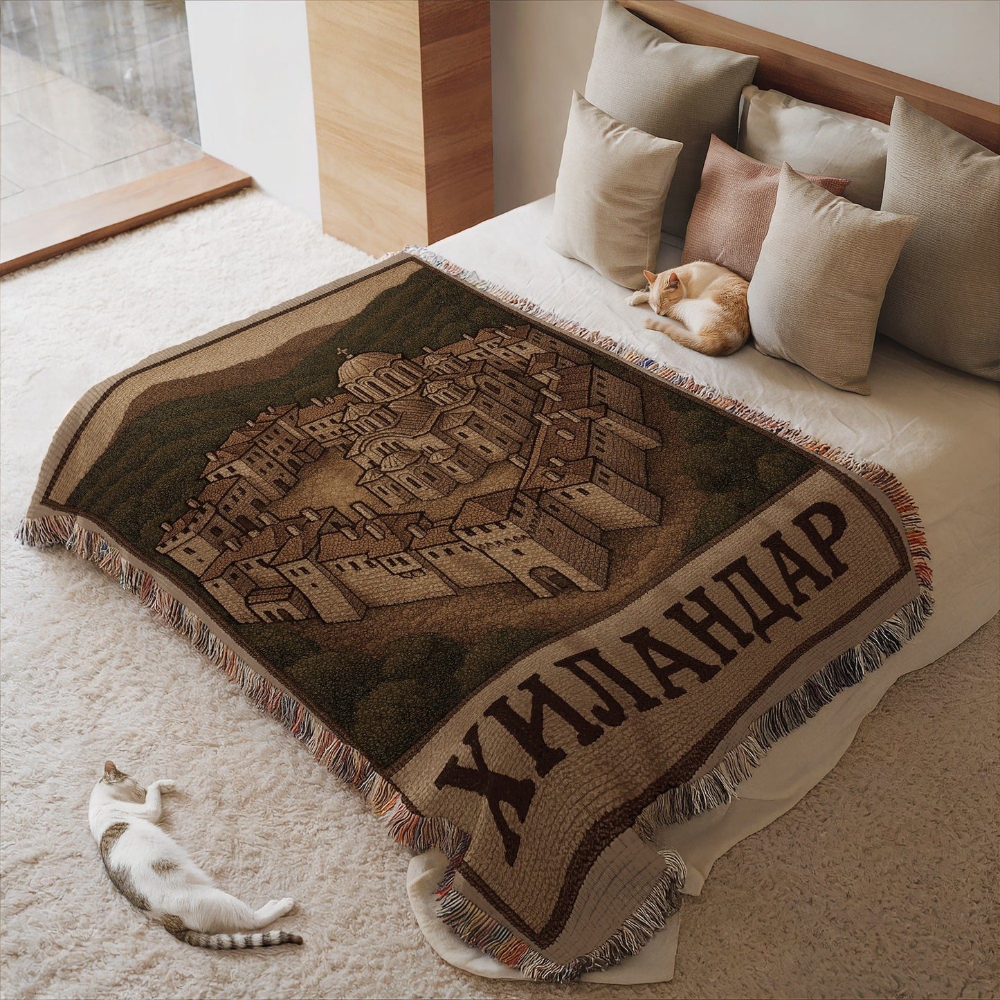 Cozy blanket with detailed village scene and fringe details