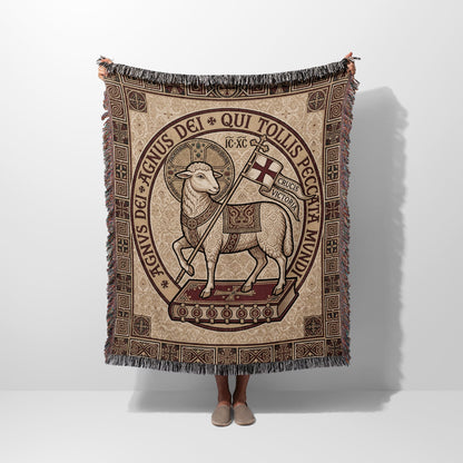 Lamb of God tapestry blanket with Latin text on a book.