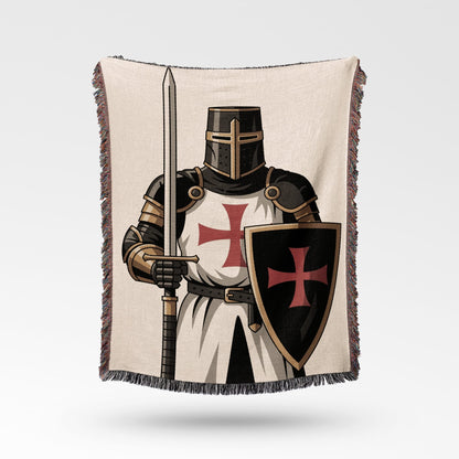 Knight in armor holding a sword and shield with red crosses.