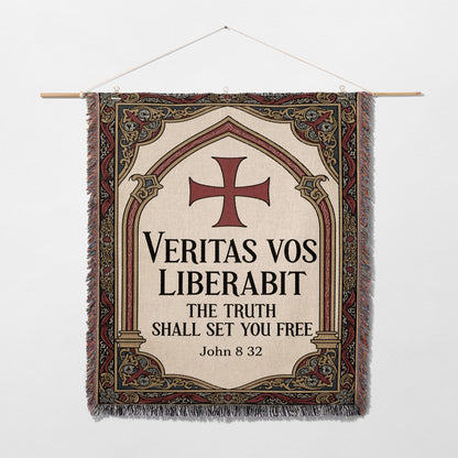 Tapestry with a cross and Latin text "Veritas vos liberabit. The truth shall set you free. John 8:32".