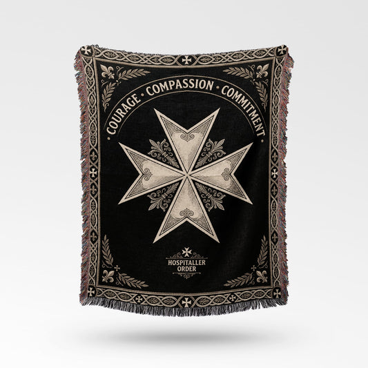 Black blanket with a white Maltese cross and "COURAGE COMPASSION COMMITMENT" text.