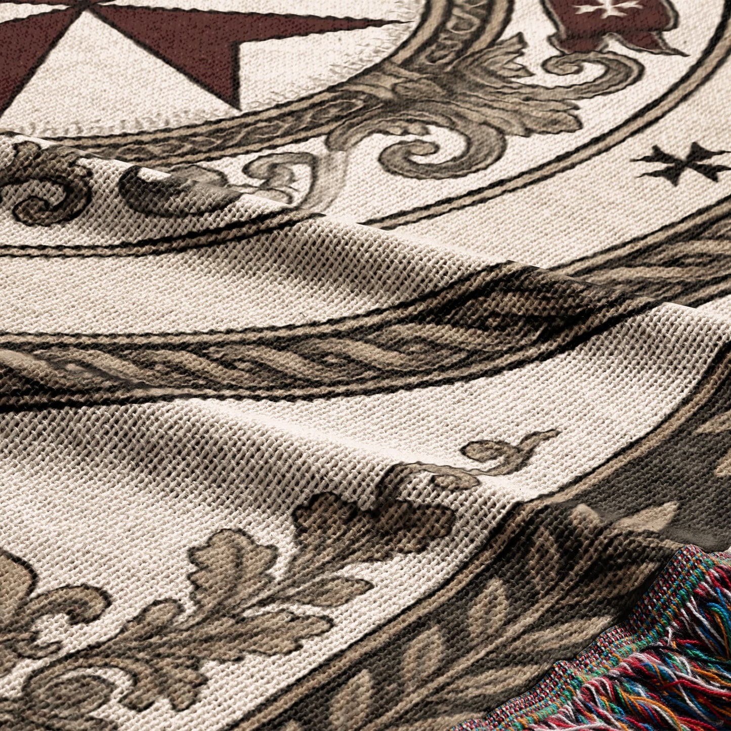 Woven textile with intricate brown scrollwork and a red star design.