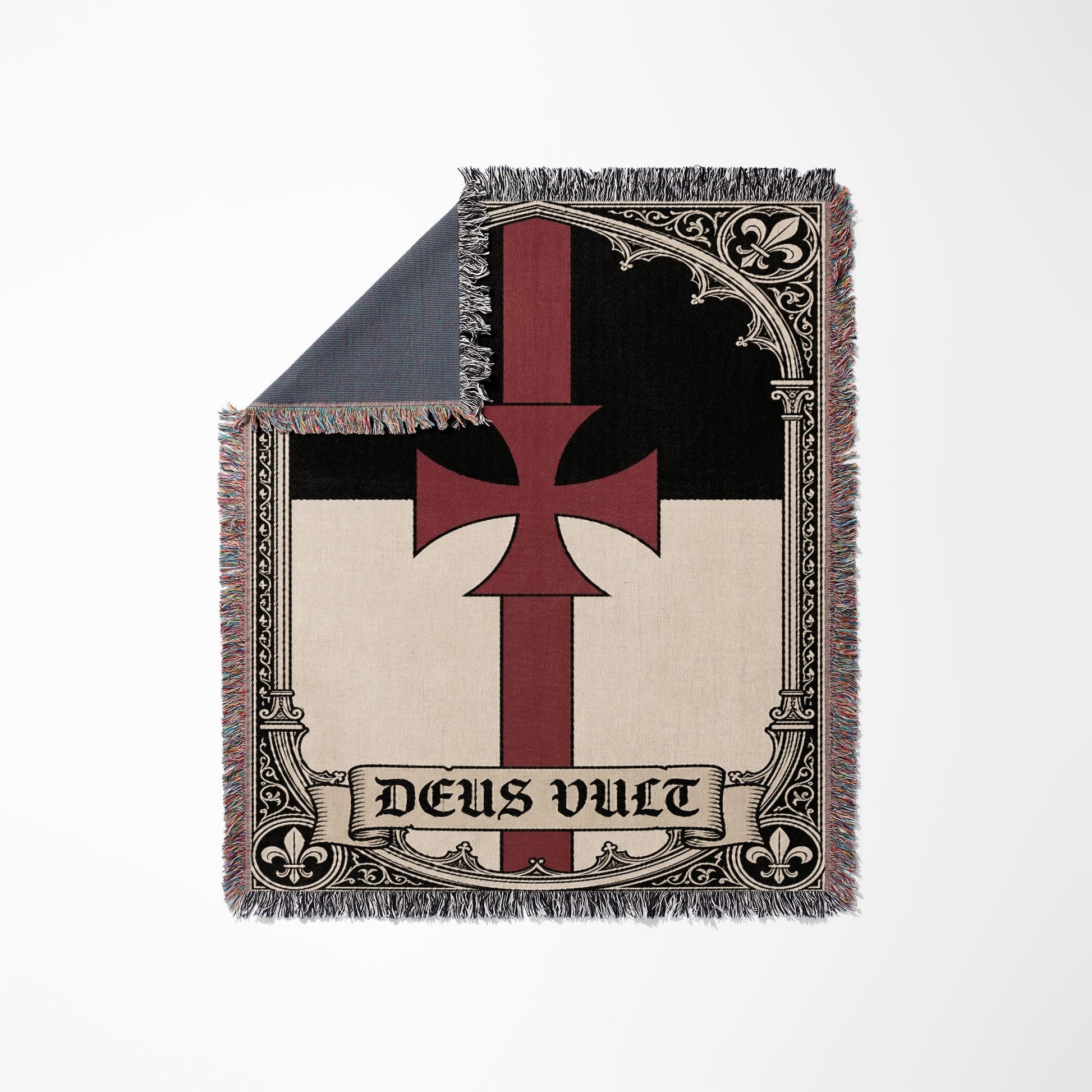 Templar cross with "Deus Vult" text on a woven blanket.