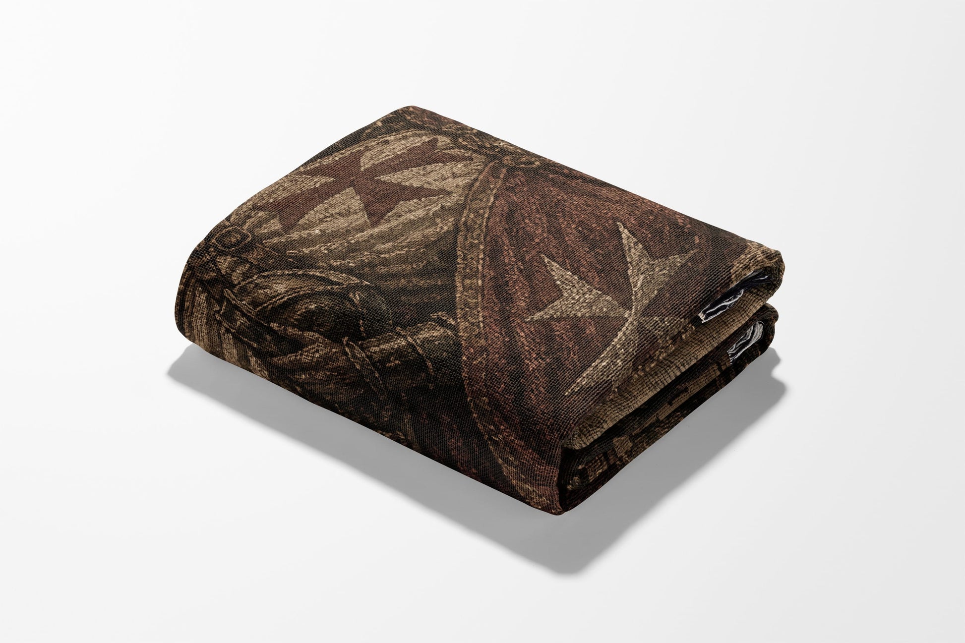 Folded tapestry with a cross and star pattern.