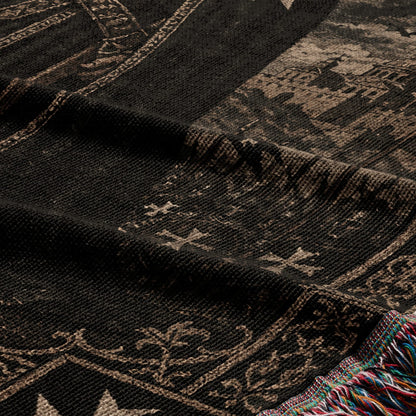 Dark tapestry with intricate historical patterns and a colorful fringed edge.