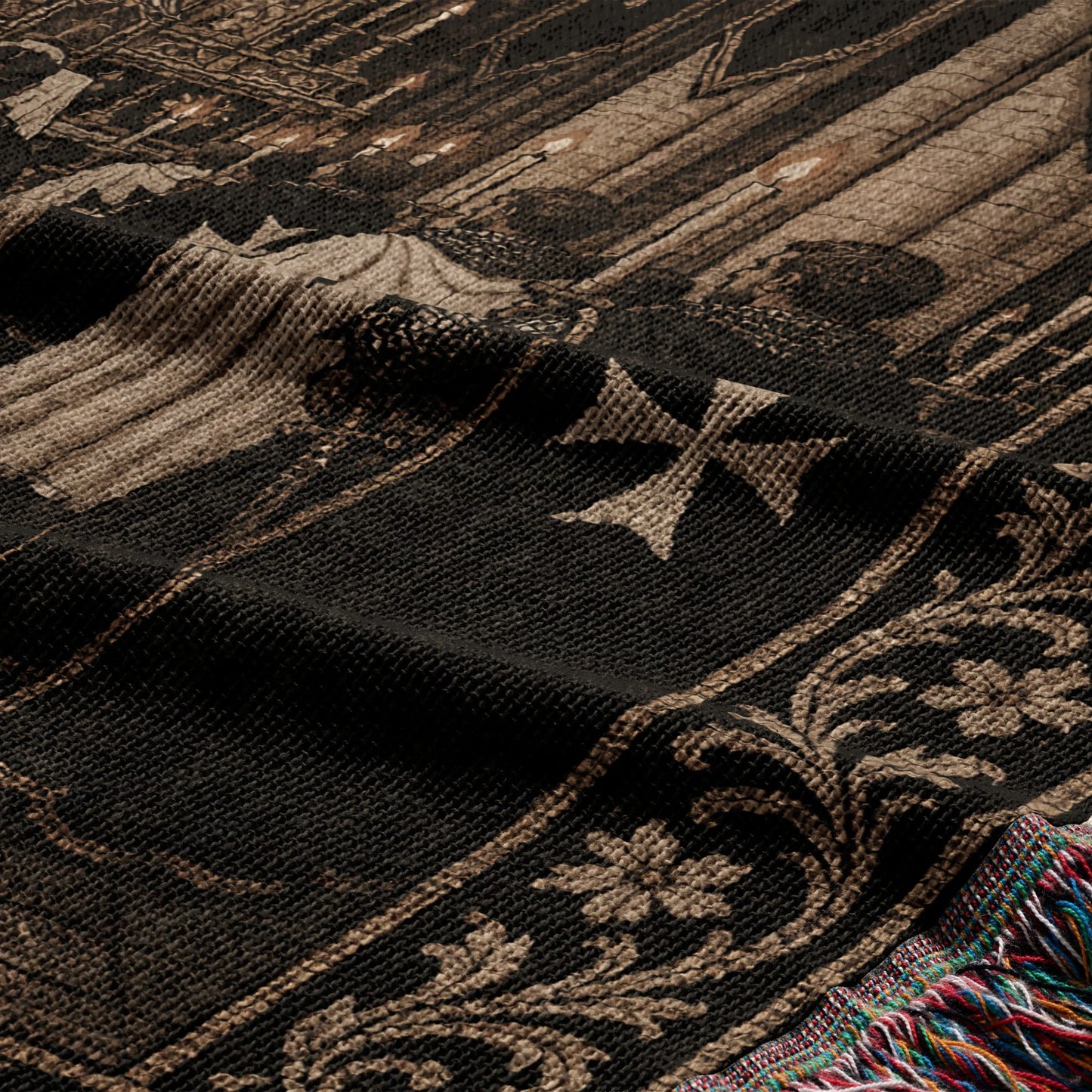 Black tapestry with cross motif, floral border, and colorful fringe.