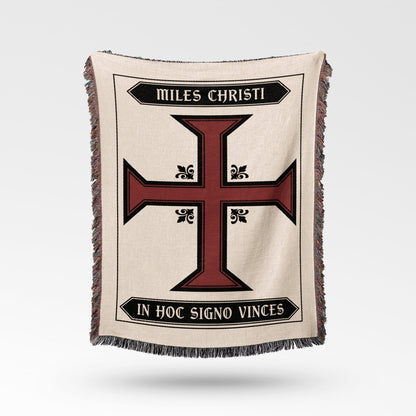 Cream blanket with a red and black Templar cross and Latin text.