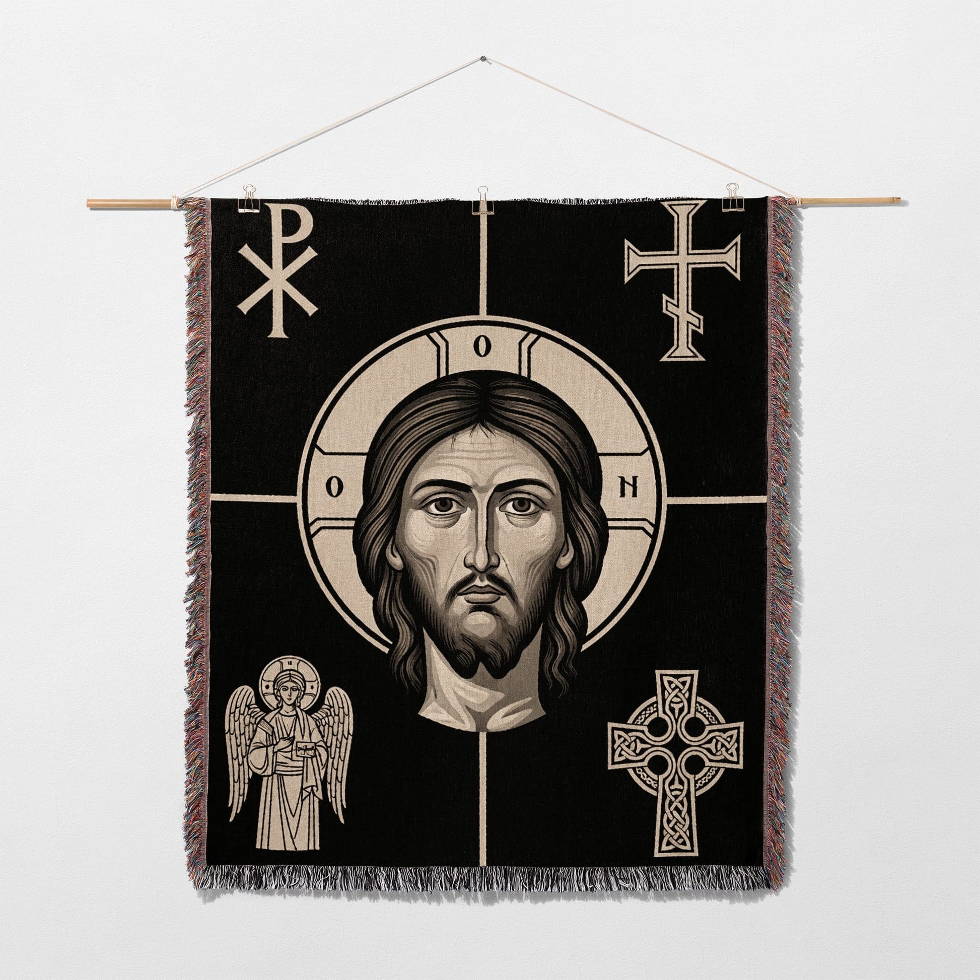 Religious tapestry with Christ's face, angels, and crosses.