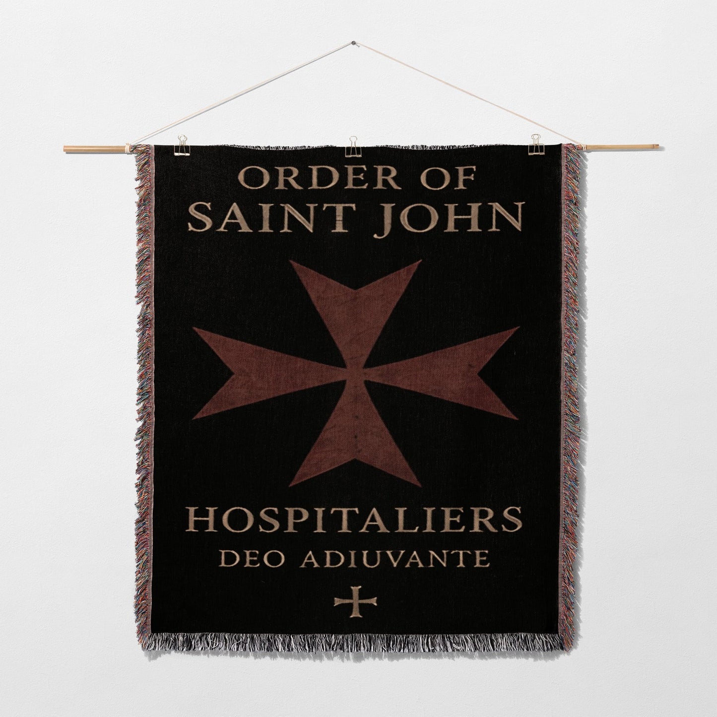 Black tapestry with Order of Saint John Hospitallers logo and Latin motto.