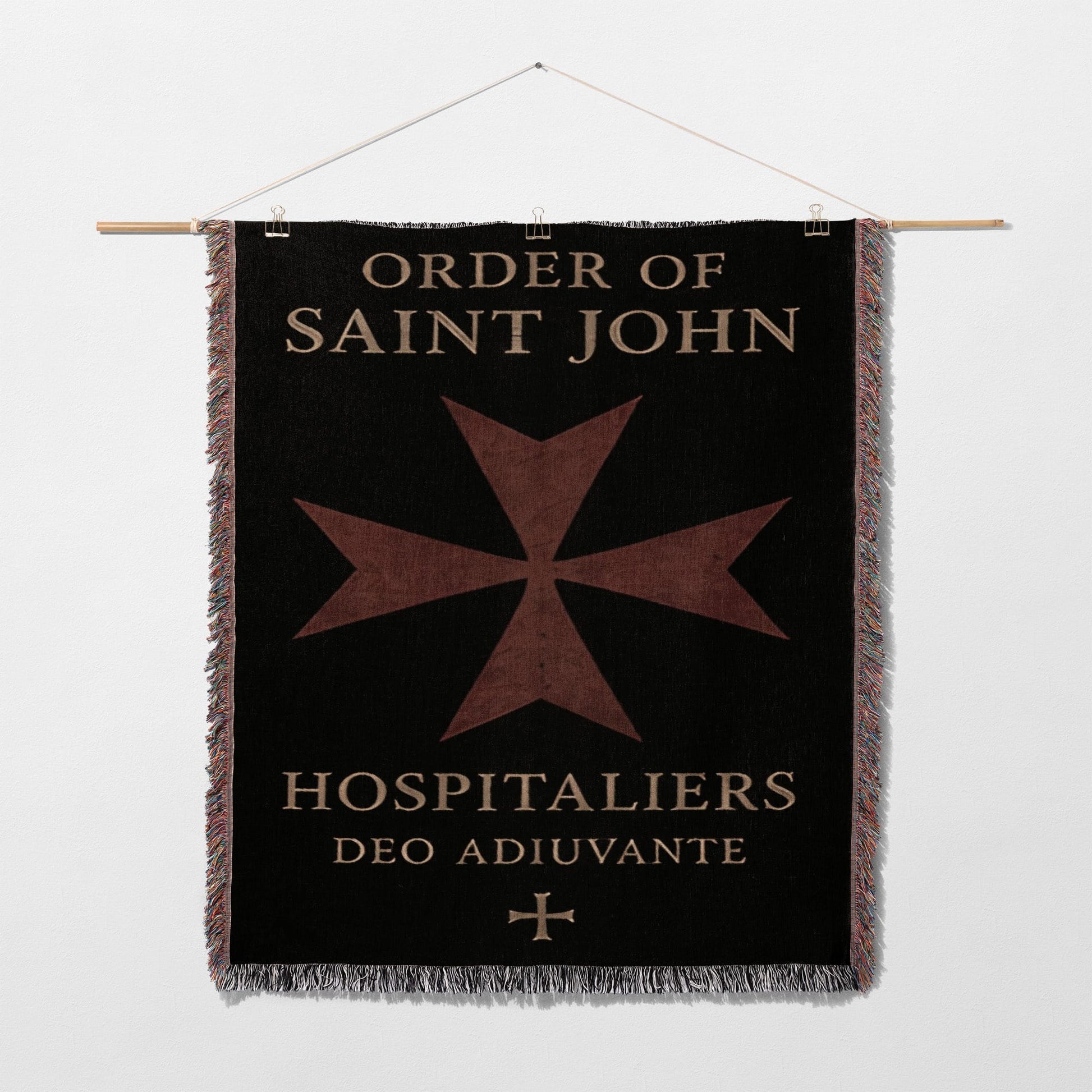 Black tapestry with Order of Saint John Hospitallers logo and Latin motto.