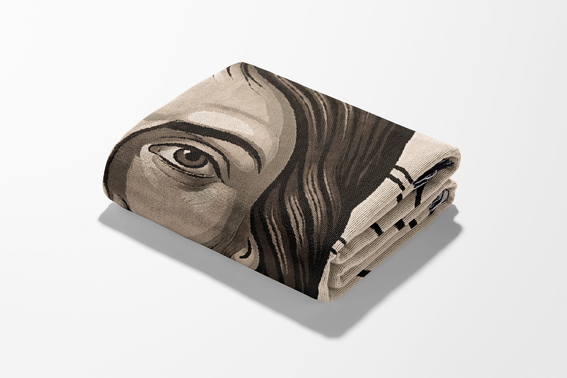 Folded blanket with a close-up portrait of a person's eye.
