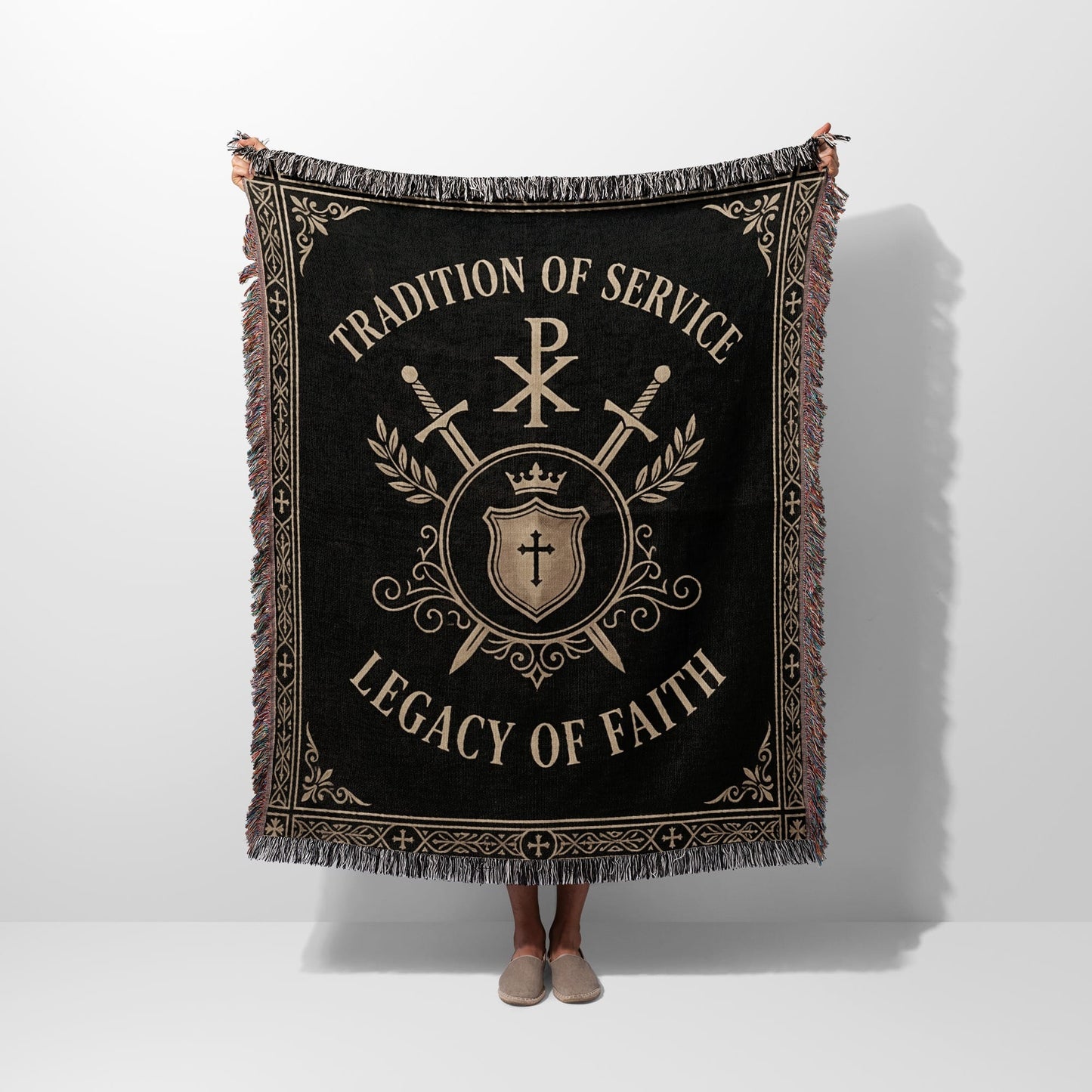 Black woven blanket with crest, swords, and text "TRADITION OF SERVICE LEGACY OF FAITH".