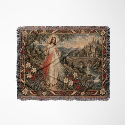 Woven blanket depicting Jesus in a pastoral landscape with a river, bridge, and floral border.