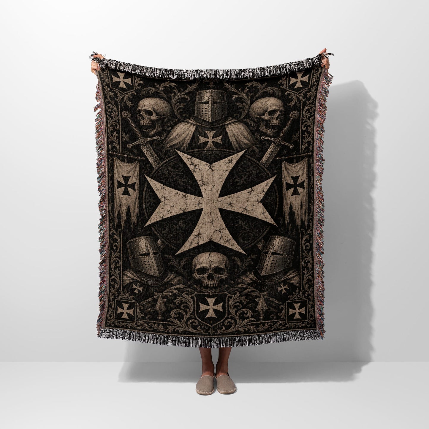Tapestry blanket with Knights Templar cross, helmets, swords, and skulls.