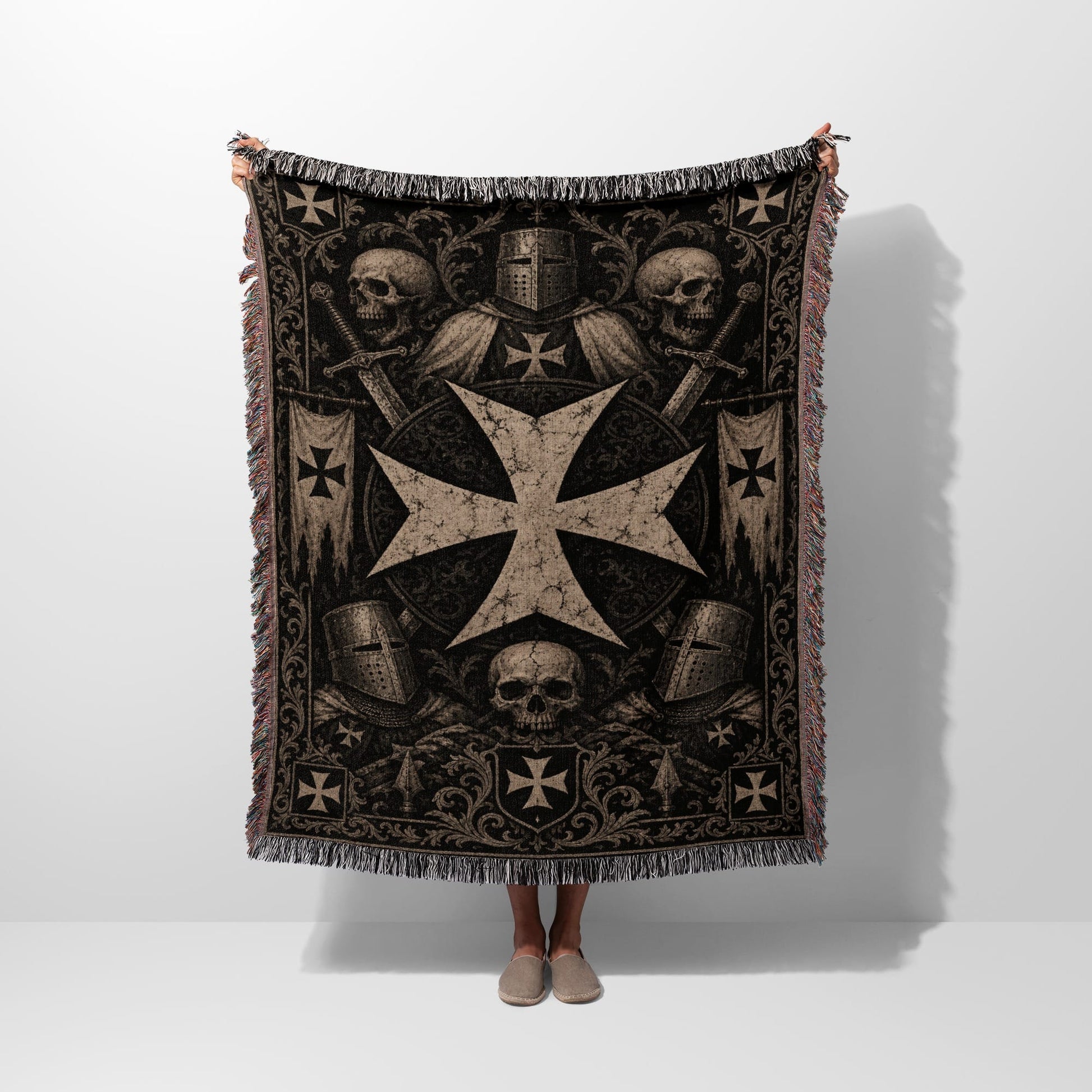 Tapestry blanket with Knights Templar cross, helmets, swords, and skulls.