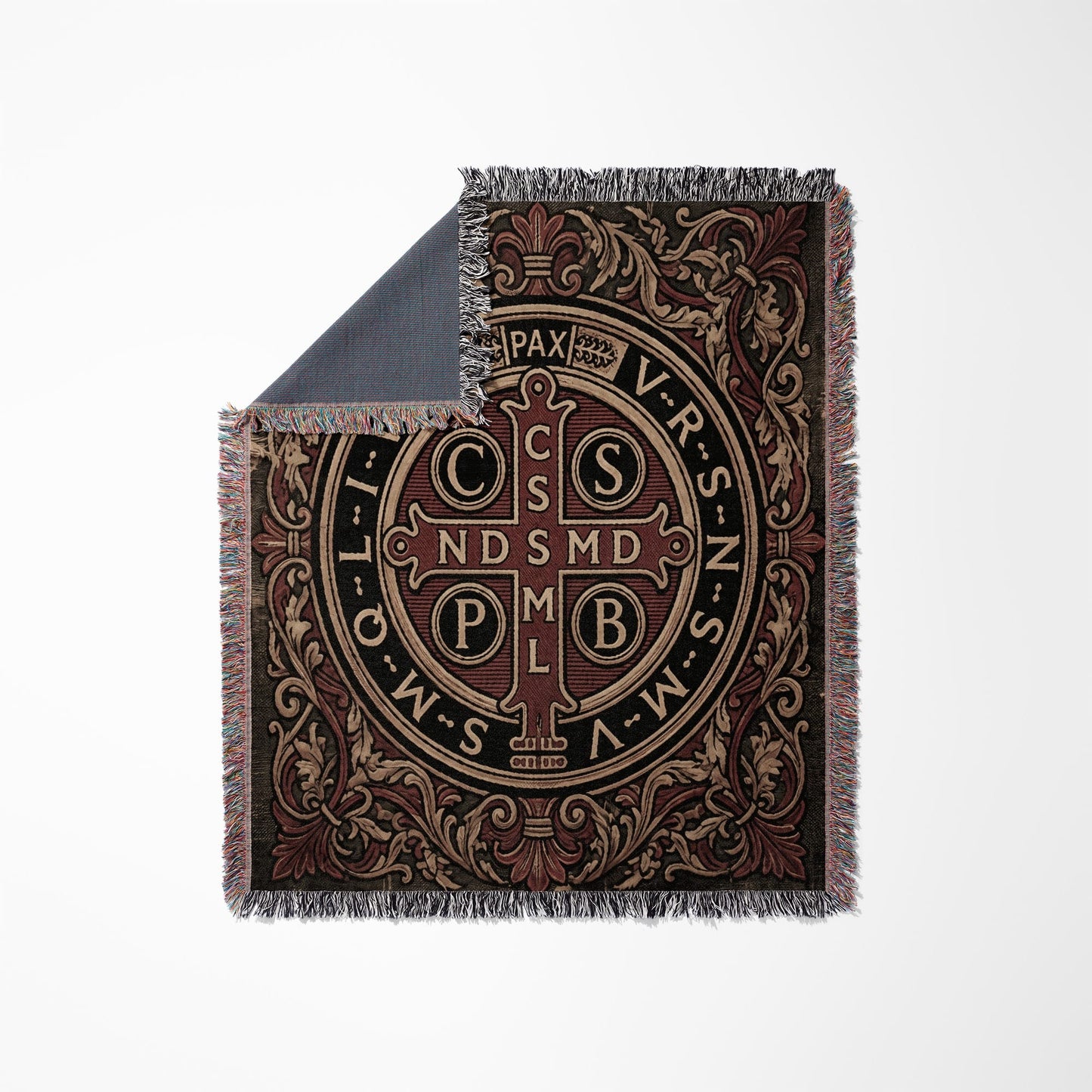 Tapestry blanket with a St. Benedict cross design and decorative border.