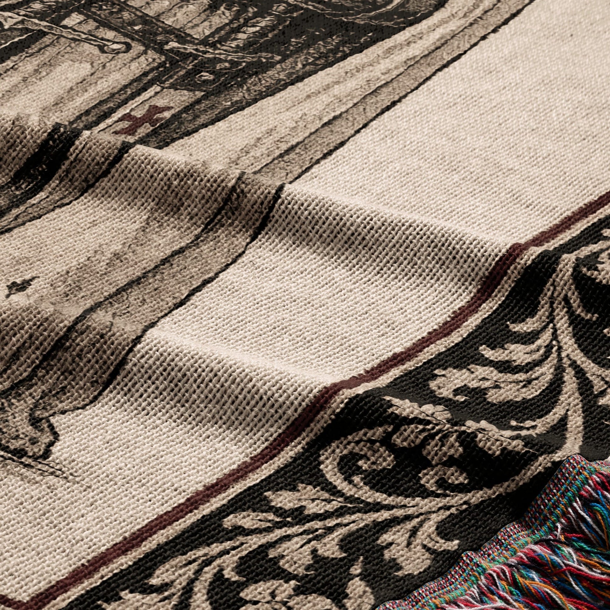 Tapestry with ornate border and fringed edge, abstract detail.
