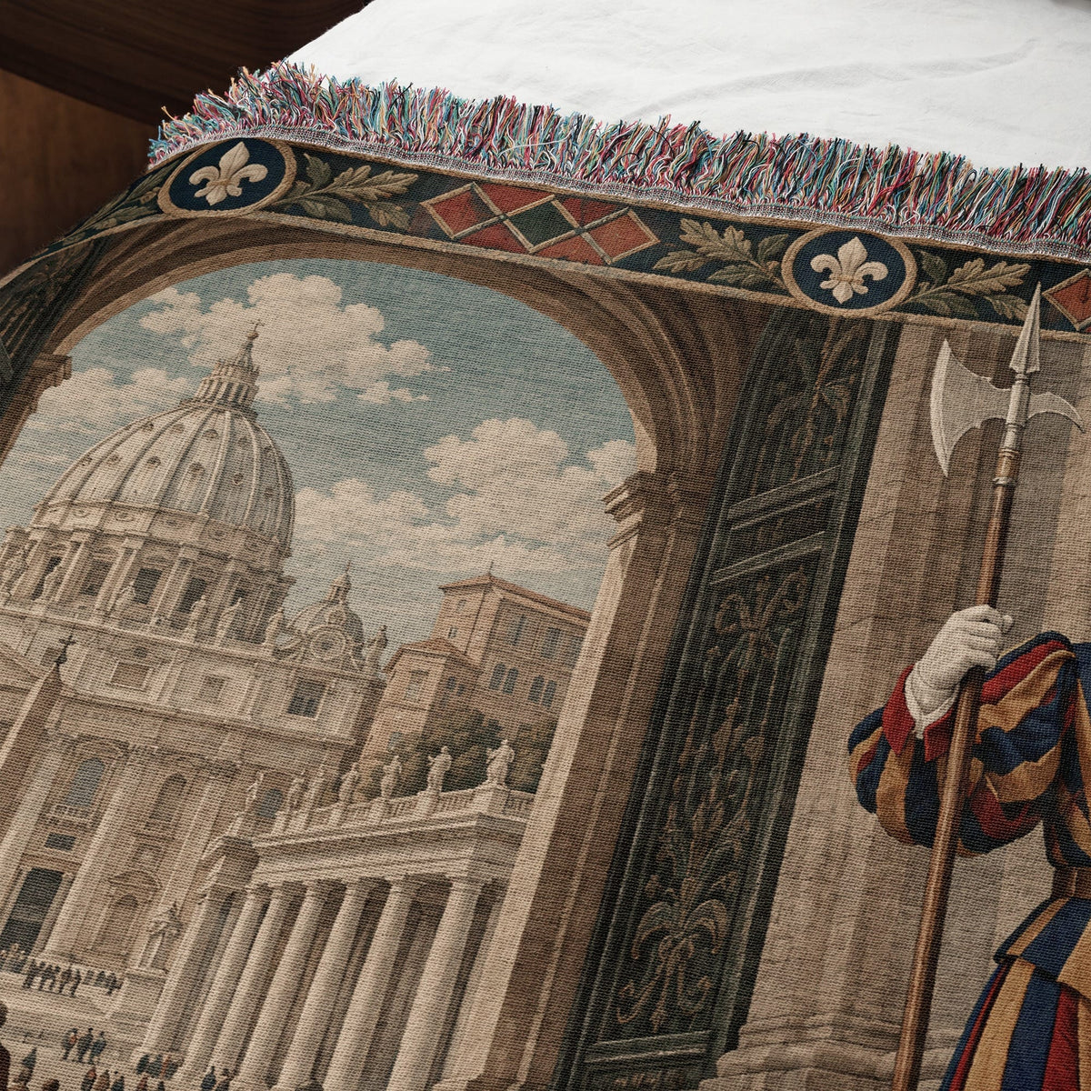 Woven tapestry featuring Saint Peter's Basilica, a Swiss Guard, and a decorative fringe border.