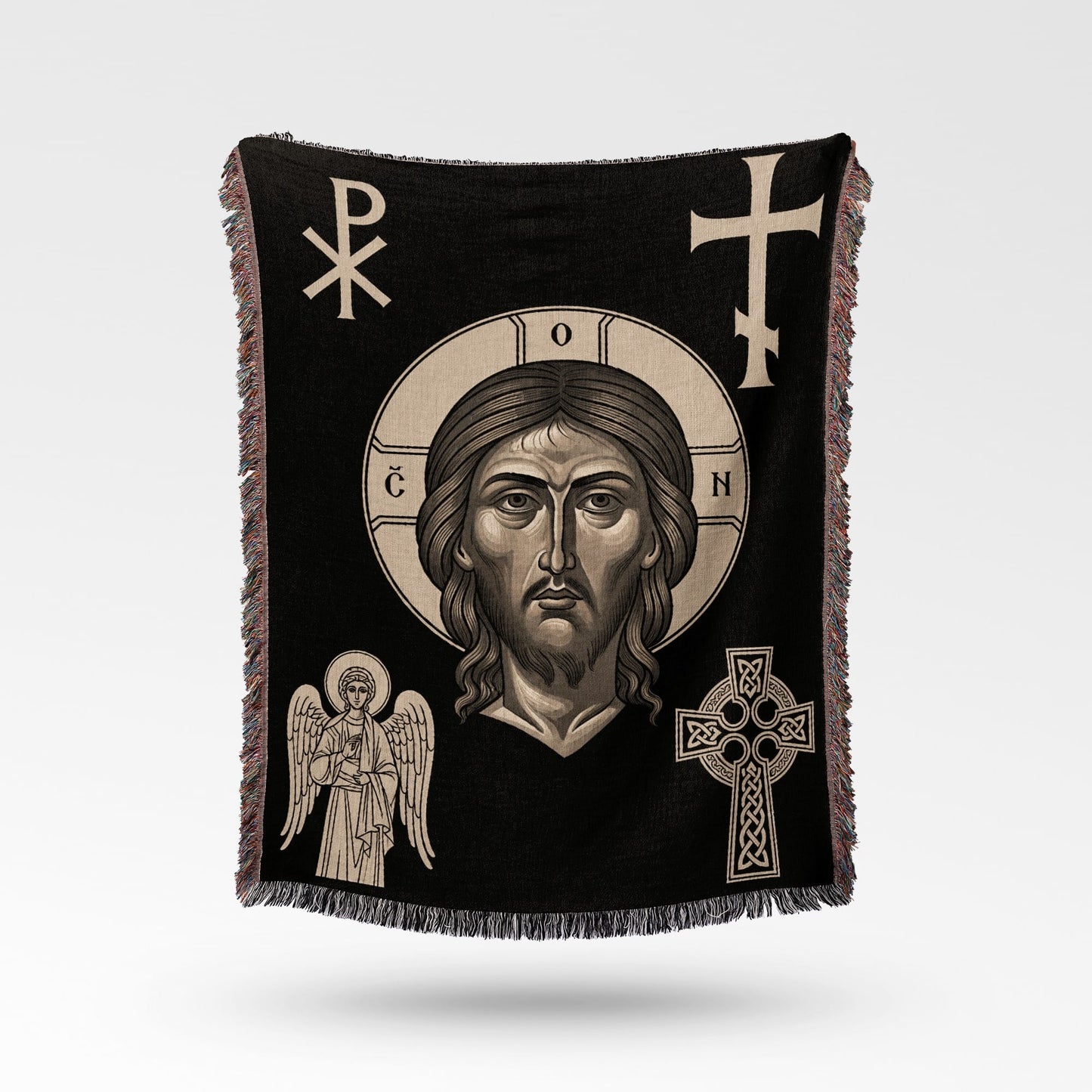 Black throw blanket with Jesus, an angel, and Celtic cross designs.